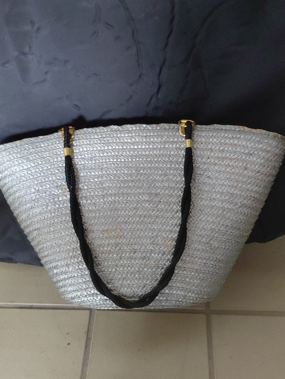 Newport News Silver Woven Tote with Black Rope Handles With Gold Tone Accents.